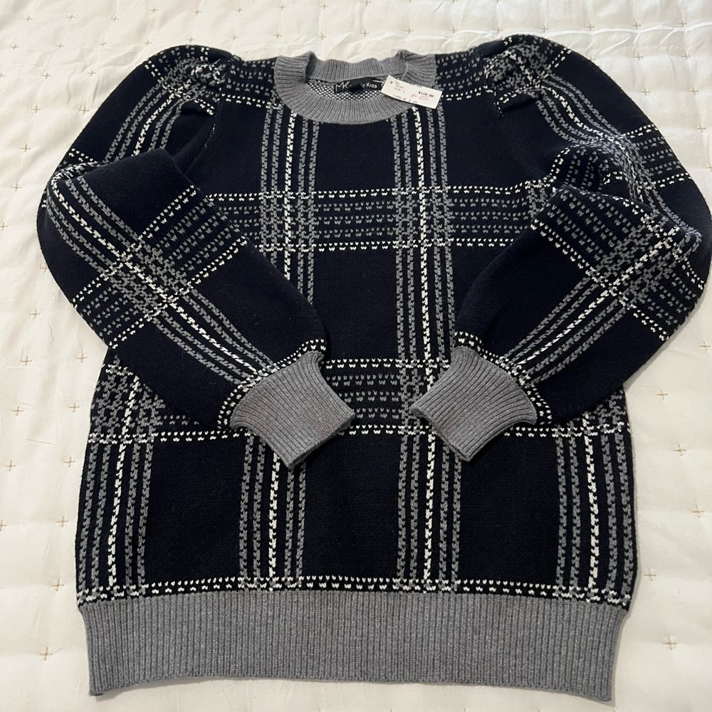 Classic black plaid sweater with puff sleeve.